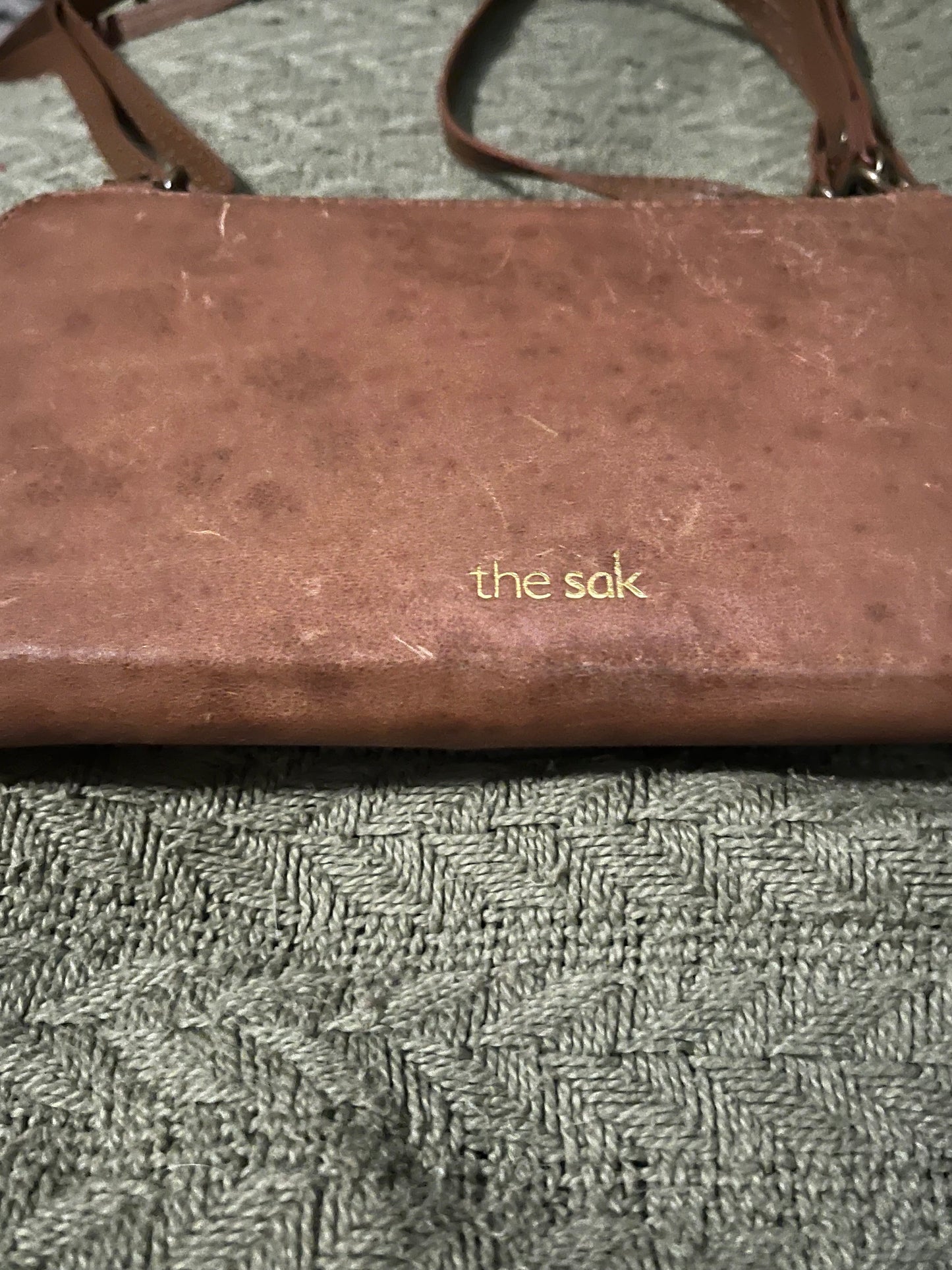 The Sak brown leather phone handbag