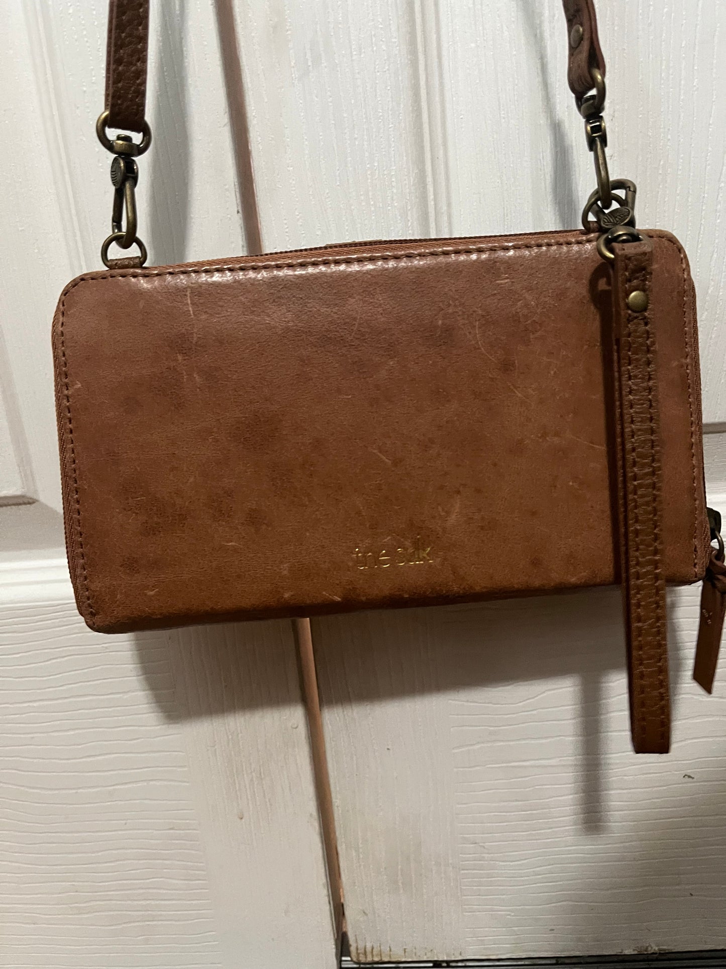 The Sak brown leather phone handbag