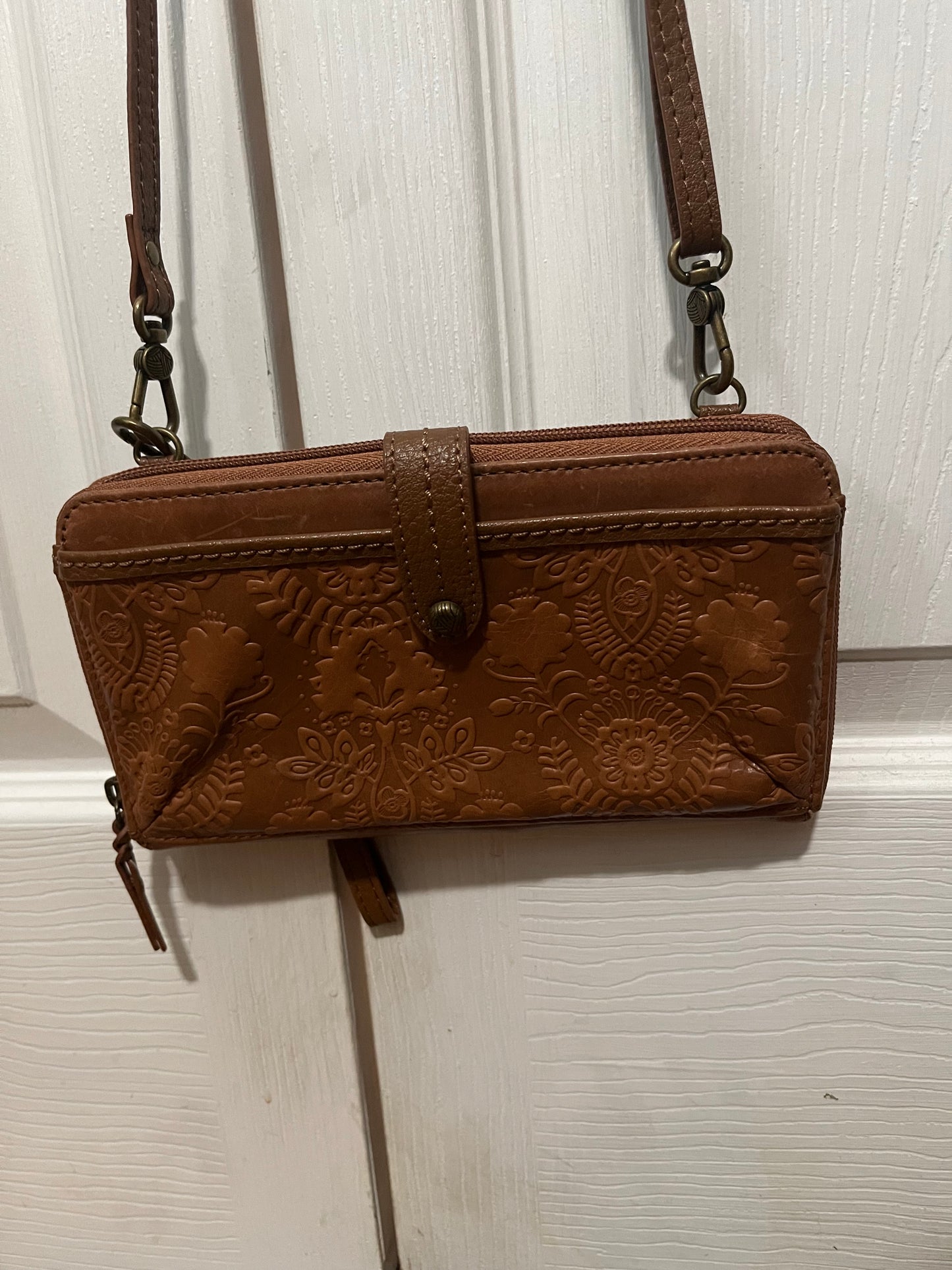 The Sak brown leather phone handbag